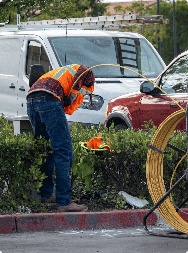 Plumber using inspection camera red overalls pipe inspection